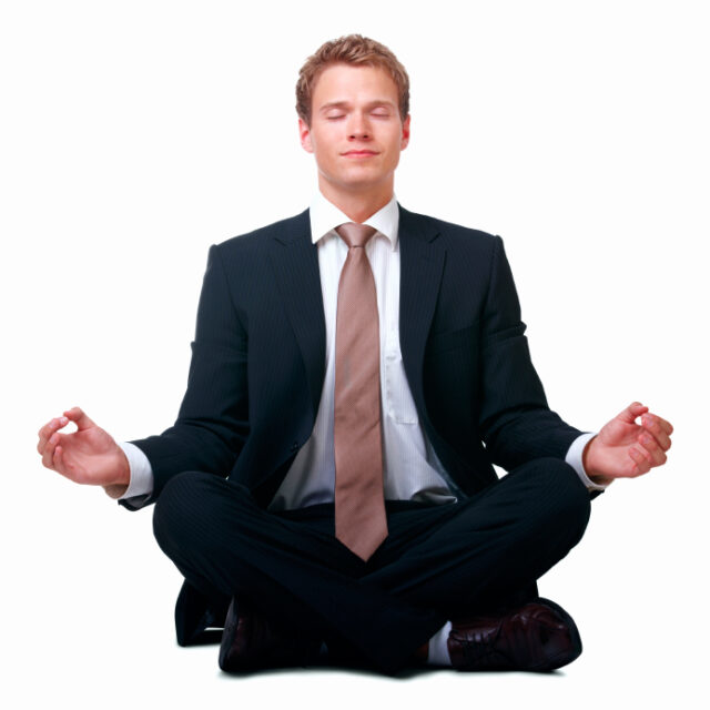 Businessman sitting in lotus position